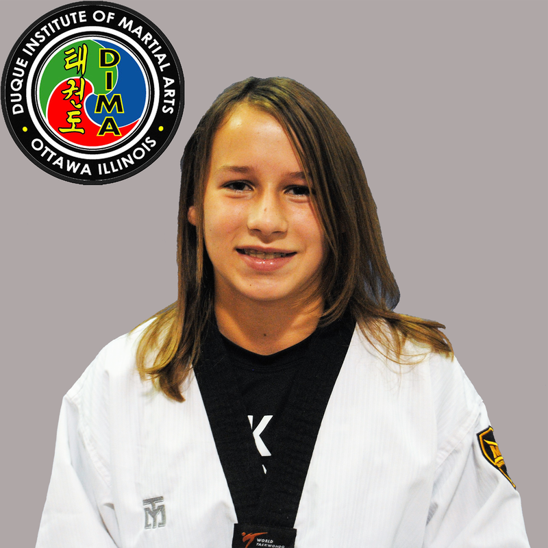 Young girl in taekwondo uniform with long dark hair