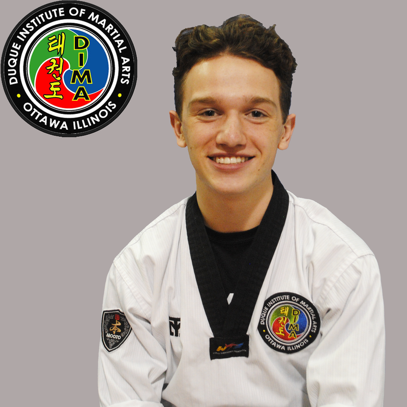 Young man in taekwondo uniform with short brown hair