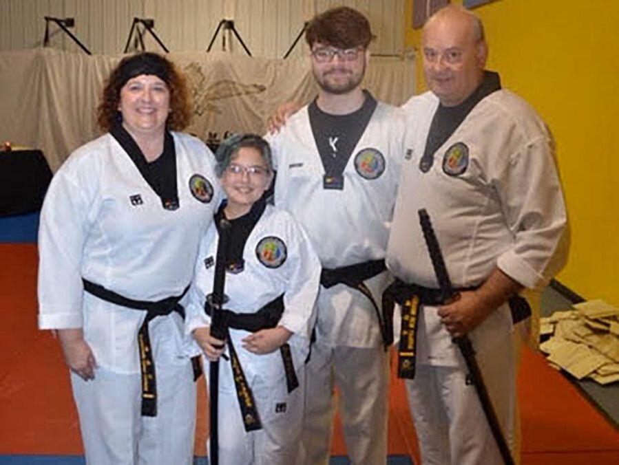 DIMA's first black belt family - mom, dad, brother, and sister.